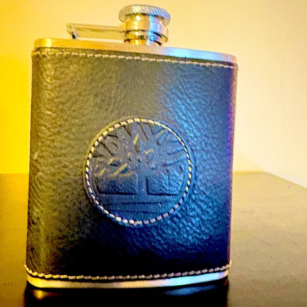 Timberland stainless steel flask in leather case. Screw on top. 3 oz.